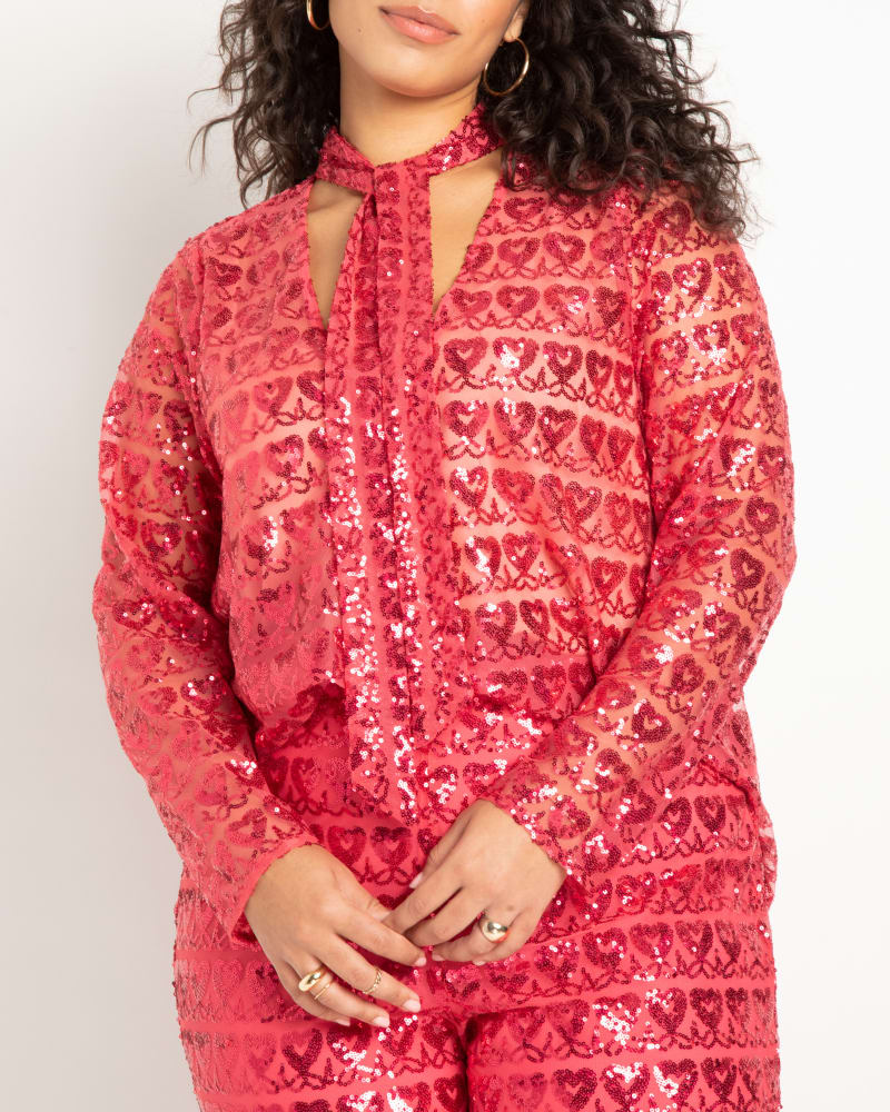 Front of a model wearing a size 18 Novelty Sequin Top in Hot Pink by ELOQUII. | dia_product_style_image_id:272947